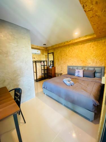 Postel nebo postele na pokoji v ubytování Thawat Boutique Resort