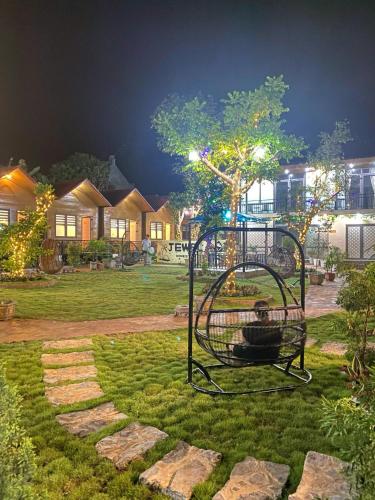 a playground in the middle of a yard at night at Jewel Homestay in Hai Phong