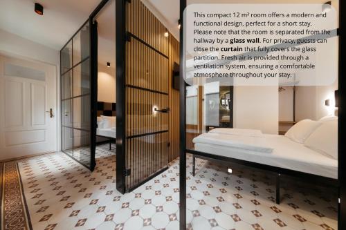 a bedroom with a bed and a mirrored wall at Main Square Apartments & Rooms in Maribor