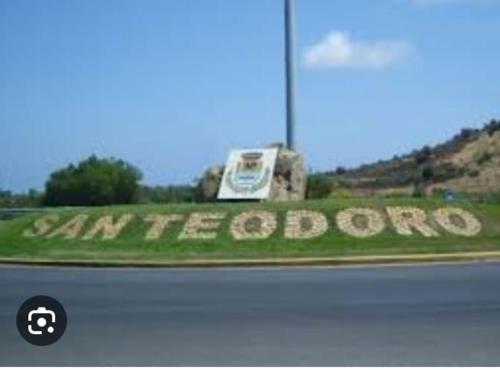 a sign on the side of a road that reads car horoco at Affittacamere Mary's Rooms in San Teodoro