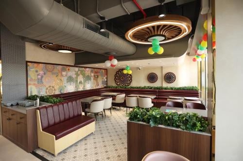 a dining room with a table and chairs at Hotel Prem Inn in Vrindāvan