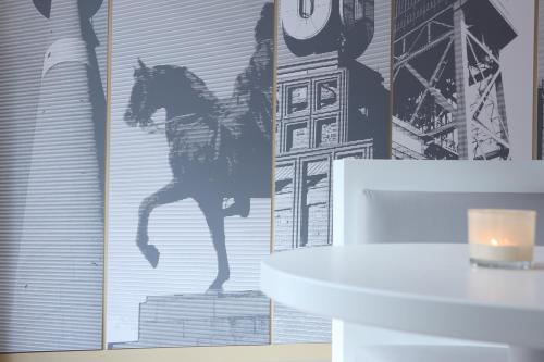 a wall with a picture of a horse on it at The Grey Design Hotel in Dortmund