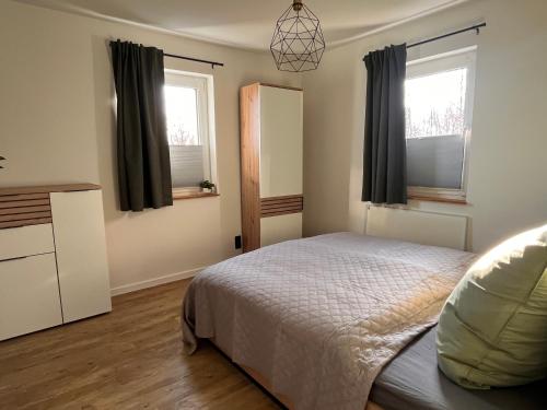 Postel nebo postele na pokoji v ubytování Hinterhaus am Stadtrand Chemnitz