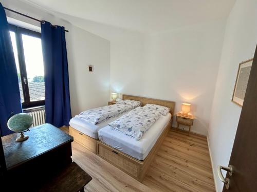 a bedroom with two beds and a window at Gem in the nature- huge garden & view in Rovio