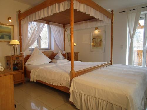 a bedroom with two beds and a canopy bed at Chalet Valley in Valley