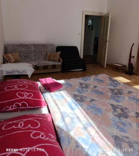 a living room with a bed and a couch at Apartments " VINTAGE " Teplice in Teplice