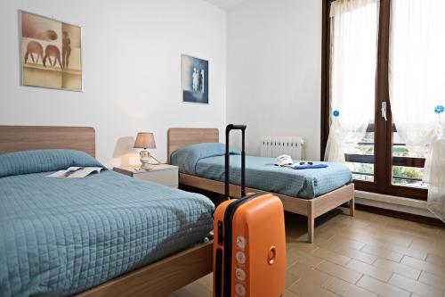 En eller flere senge i et værelse på VILLA VALESANA - Regarda Travel