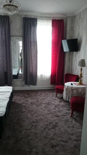 Postel nebo postele na pokoji v ubytování Hotell Floras Trädgård