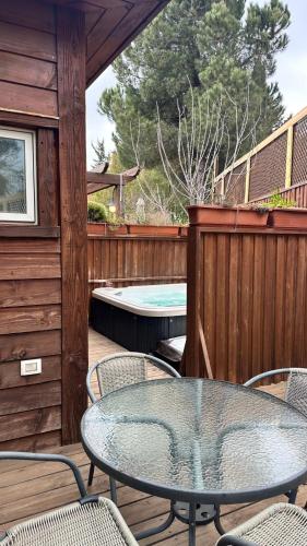 a patio with a table and chairs and a pool at BeLev Odem in Odem
