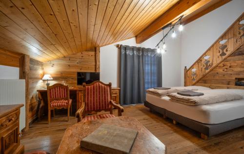 Postel nebo postele na pokoji v ubytování Hôtel Le Grand Chalet