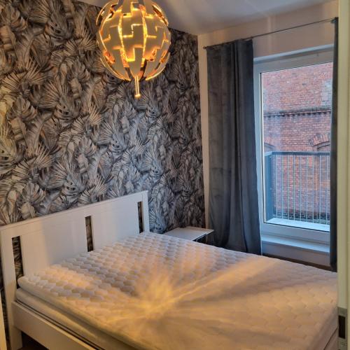 Ένα ή περισσότερα κρεβάτια σε δωμάτιο στο Apartament Skarbowa Sun