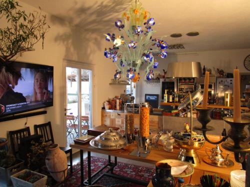 a living room with a table with a chandelier at Chalet Valley in Valley
