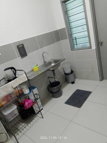 a bathroom with a sink and a toilet and a sink at Prima Resident Meru Ipoh in Ipoh
