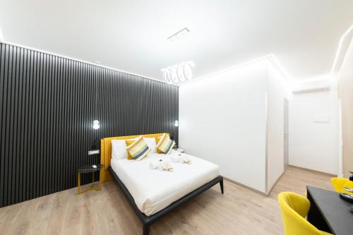Ένα ή περισσότερα κρεβάτια σε δωμάτιο στο Teulada Luxury Rooms