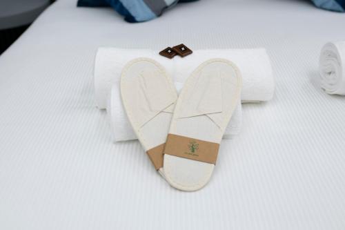 Ένα ή περισσότερα κρεβάτια σε δωμάτιο στο Teulada Luxury Rooms