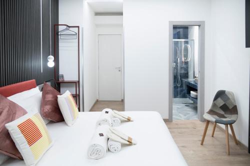 Ένα ή περισσότερα κρεβάτια σε δωμάτιο στο Teulada Luxury Rooms