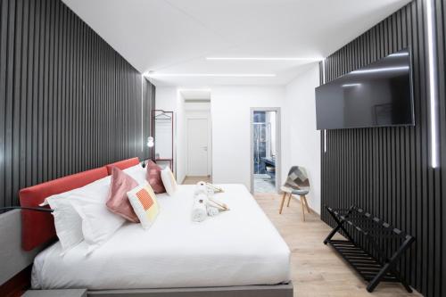 Μια τηλεόραση ή/και κέντρο ψυχαγωγίας στο Teulada Luxury Rooms