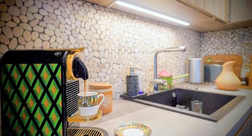 a kitchen with a sink and a counter top at Oasis of charm in Brussels! in Brussels