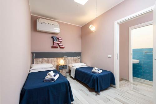 En eller flere senge i et værelse på I Tre Golfi - Residenza Cala Azzurra