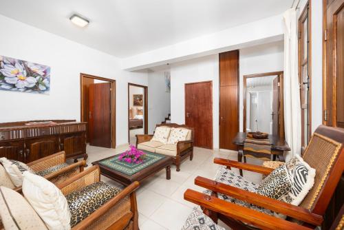 a living room with couches and a table at Villa Irene Palace in Paphos