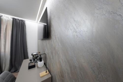 Μια τηλεόραση ή/και κέντρο ψυχαγωγίας στο Teulada Luxury Rooms