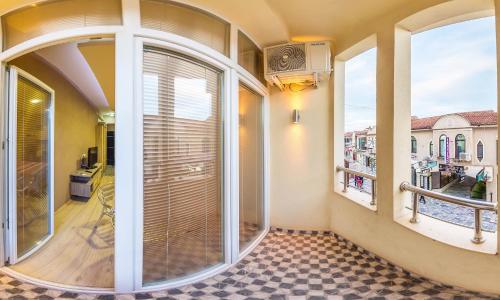 a room with large windows and a balcony at Villa Sveti Gorgi in Ohrid