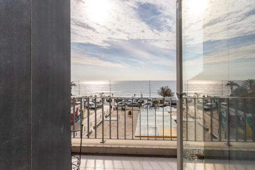 a view of the ocean from a balcony at Casa da Praça Guest House in Sesimbra