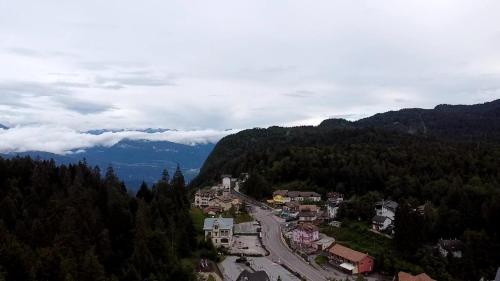 an aerial view of a village in the mountains at SISSI MENDEL Residence in Ronzone