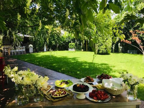 a table with plates of food on top of it at Hotel Vanilla in Timişoara