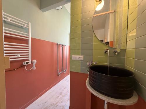 a bathroom with a large tub in the corner at House Farorosmarino by Holiday World in Chiavari
