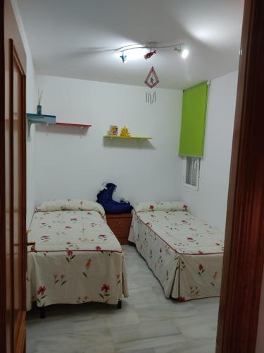 a room with two beds in a room at Apartamento torrox in Torrox Costa