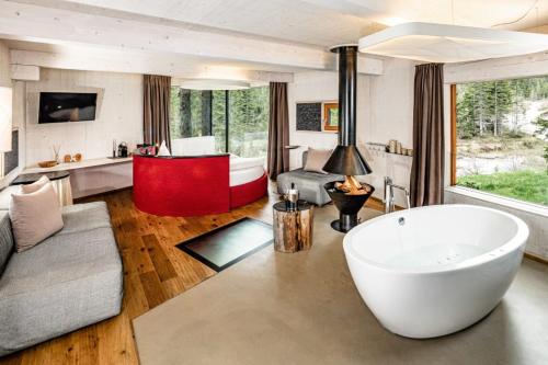 a large living room with a large tub in the middle at Caravan Park Sexten in Sesto