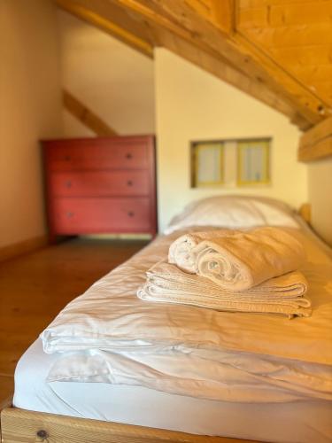 a pile of towels sitting on top of a bed at Apartments Steinwänd in Grünau im Almtal