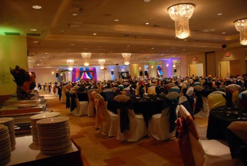 a large banquet hall with a lot of tables and chairs at Ramada by Wyndham Glendale Heights/Lombard in Glendale Heights