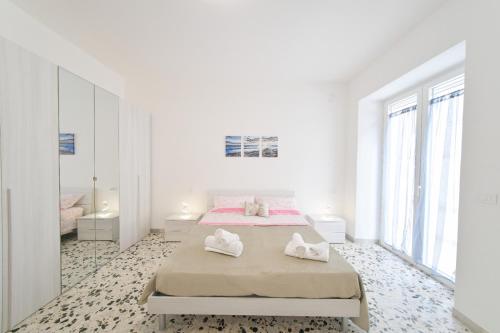 Postel nebo postele na pokoji v ubytování Casa Lulù - Appartamenti Ischia Centro