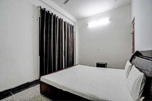 Voodi või voodid majutusasutuse Hotel O Highway Plaza And Resorts 2 toas