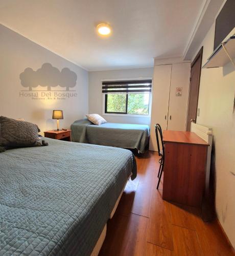 Katil atau katil-katil dalam bilik di Hostal del Bosque