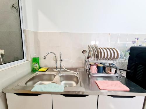a kitchen counter with a sink in a kitchen at Koi Kinrara 2 Room Puchong IOI Bkt Jalil Pavillion Sunway Pyramid Lagoon Hospital Old Klang Road in Puchong