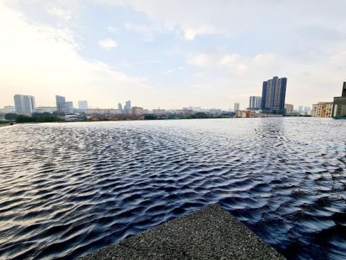 a view of the water with a city in the background at Koi Kinrara 2 Room Puchong IOI Bkt Jalil Pavillion Sunway Pyramid Lagoon Hospital Old Klang Road in Puchong