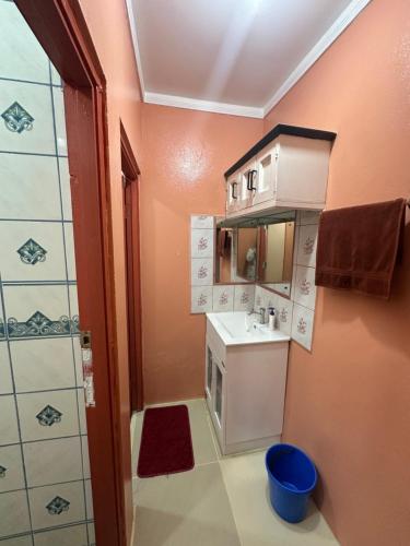 a small bathroom with a sink and a shower at Naulu apartment in Naulu
