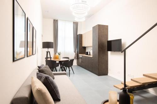 a living room with a couch and a table at New Luxury Loft - Prada-Bocconi in Milan