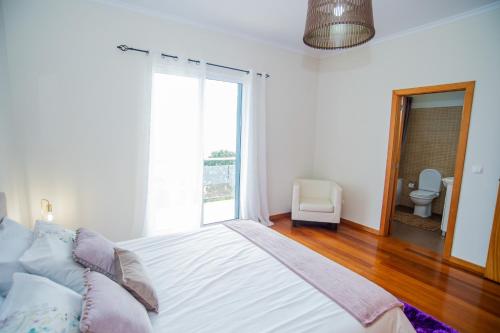 Ένα ή περισσότερα κρεβάτια σε δωμάτιο στο Bugio Guesthouse