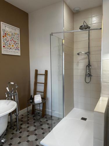a bathroom with a shower and a toilet and a sink at Maison d'hôtes - Stay and Cook in Annonay