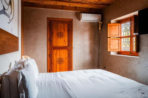 Un ou plusieurs lits dans un hébergement de l'établissement Ysalis Riad Restaurant & Spa
