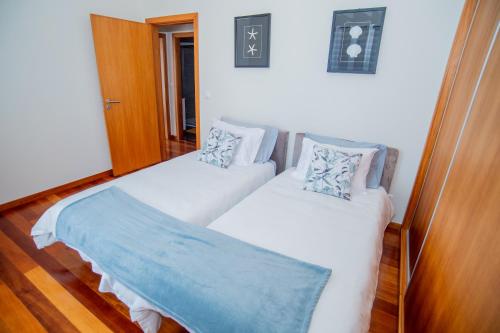 Ένα ή περισσότερα κρεβάτια σε δωμάτιο στο Bugio Guesthouse
