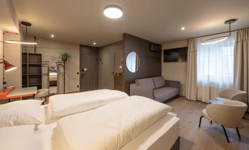 Postel nebo postele na pokoji v ubytování Hotel Gasthof Fischer