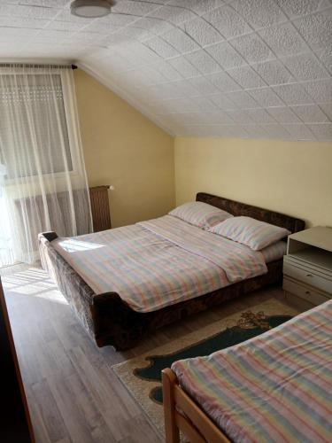 Postel nebo postele na pokoji v ubytování Kovačević apartman