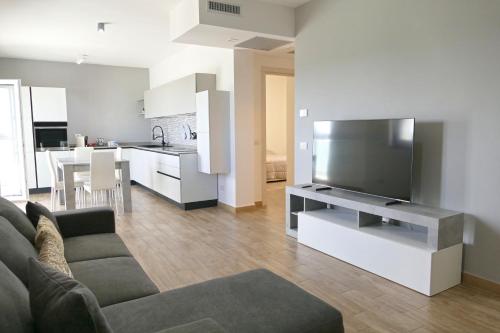 TV a/nebo společenská místnost v ubytování Relux Capurso