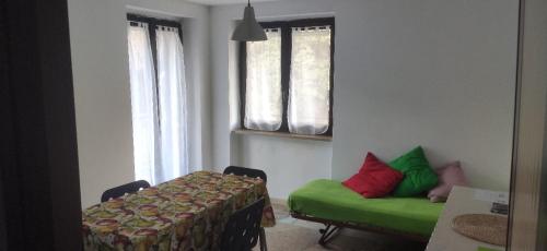 Ένα ή περισσότερα κρεβάτια σε δωμάτιο στο CASA CON VISTA A GRAVERE