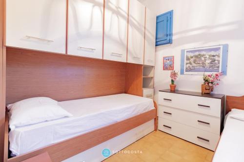 En eller flere senge i et værelse på Grecale House